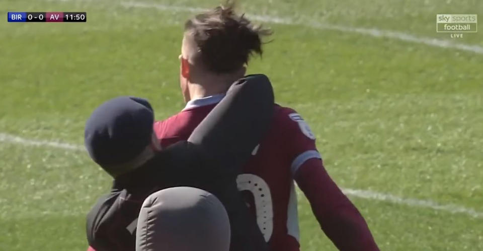 Jack Grealish is punched by Paul Mitchell after the Birmingham City fan invaded the pitch.