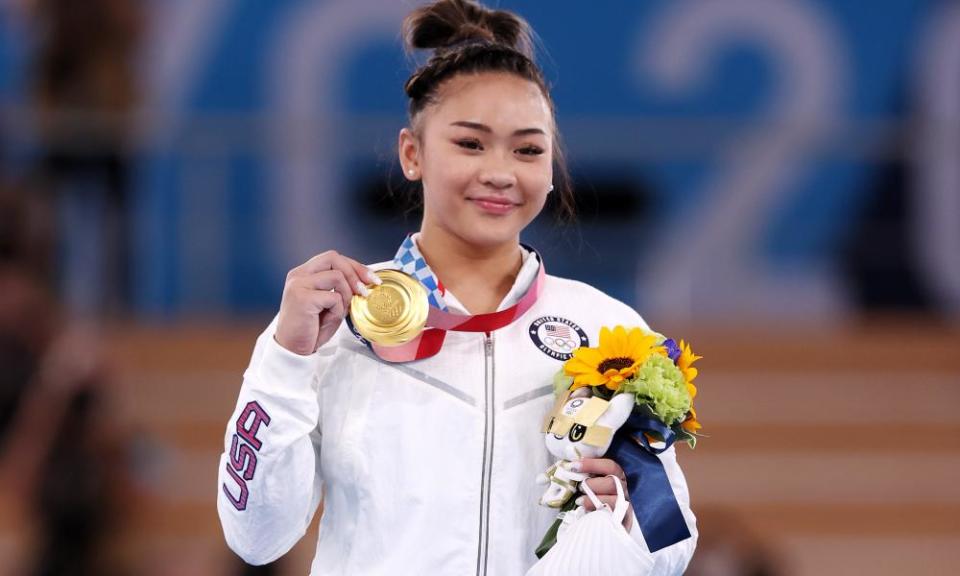 Sunisa Lee poses with her gold medal