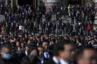 Delegates leave the Great Hall of the People after attending the second plenary session of the National People's Congress (NPC) in Beijing, Friday, March 8, 2024. (AP Photo/Andy Wong)