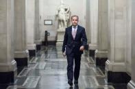 FILE PHOTO: Mark Carney, the governor of the Bank of England, walks to a monetary policy committee briefing on his first day inside the central bank's headquarters in London