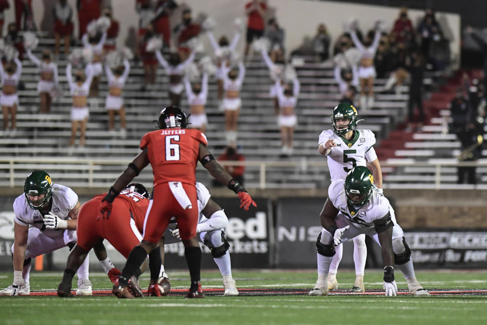 Baylor quarterback Charlie Brewer (5) calls a play against Texas Tech during the second half of an NCAA college football game in Lubbock, Texas, Saturday, Nov. 14, 2020. (AP Photo/Justin Rex)