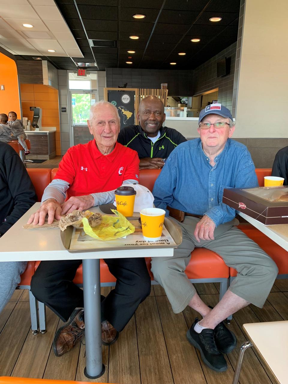 Former UC basketball coach Tay Baker (left) is joined by former player Roland West (center) and Claude Rost at a weekly gathering of Bearcats May 17.
(Photo: Thanks to Dick Bouldin)