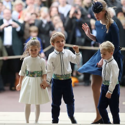 The bridesmaids and pageboys including Prince George arrive with Lady Louise Mountbatten-Windsor  - Credit: AFP
