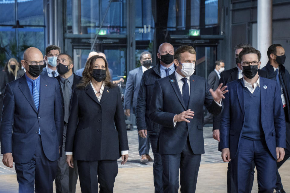 From left, former European Trade Commissioner Pascal Lamy, Vice President Kamala Harris, French President Emmanuel Macron and French historian Justin Vaïsse arrive at a Paris Peace Forum, Thursday, Nov. 11, 2021 in Paris. The forum focuses on gaps in global health, post-COVID recovery and looking ahead for new principles of action for the post-COVID world. (Sarahbeth Maney/The New York Times via AP, Pool)