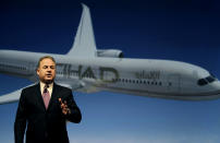 Etihad Chief Executive James Hogan, speaks during a press conference in Abu Dhabi, United Arab Emirates, Sunday, May 4, 2014. Etihad Airways, a fast-growing Mideast carrier, laid out plans Sunday to offer passengers who find first-class seats a bit too tight a miniature suite featuring a closed-off bedroom, private bathroom and a dedicated butler. Hogan conceded that offering what the airline says is the first-of-its kind multi-room suite helps generate buzz, but that ultimately it is a serious effort to bring in more cash. (AP Photo/Kamran Jebreili)