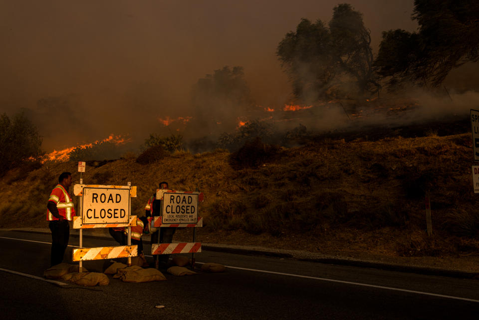 A road is closed to traffic as the Easy Fire burns in Simi Valley, California, on Oct. 30, 2019.  (Photo: Justin L. Stewart/ZUMA Wire)