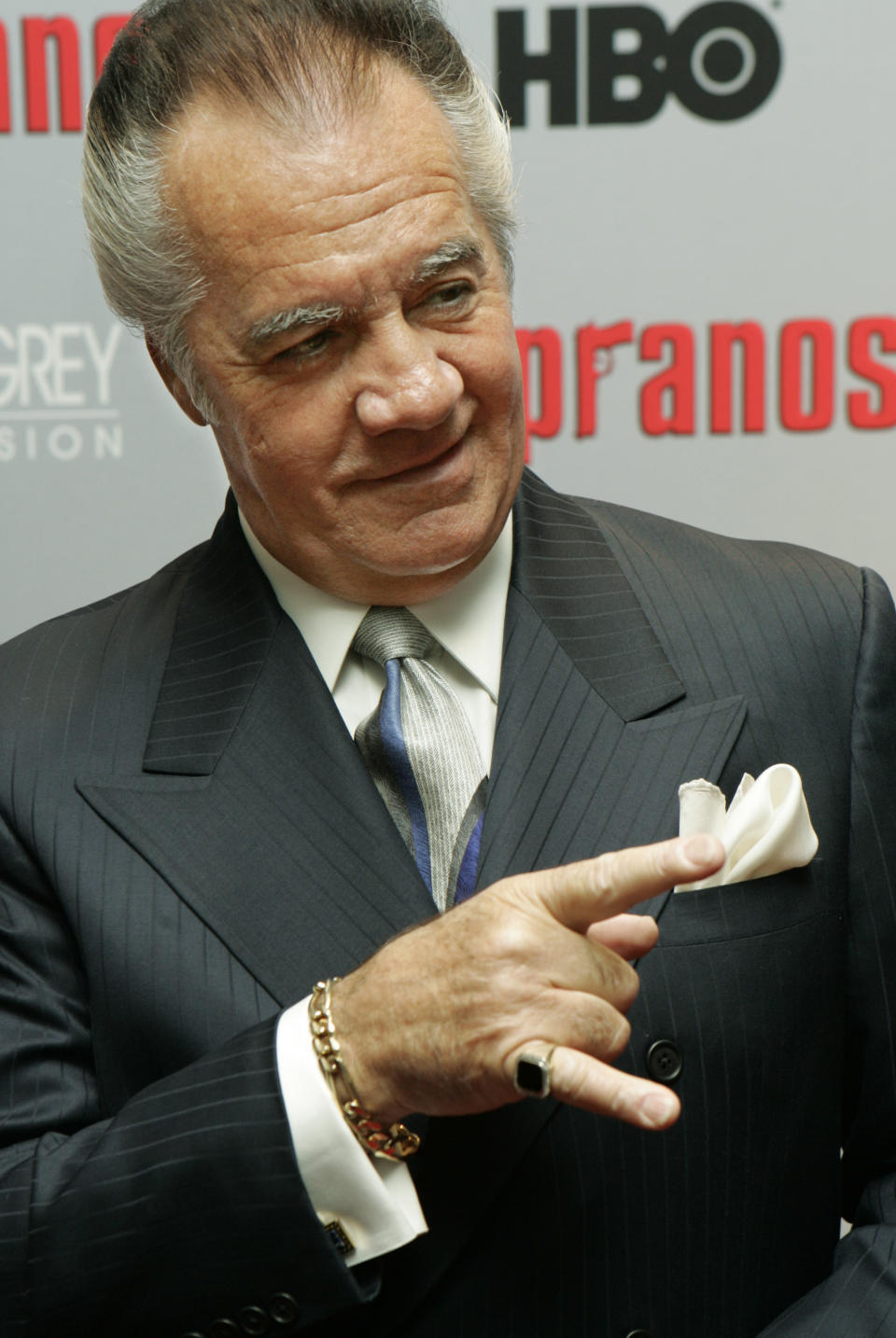 FILE - Tony Sirico, who plays the role of Paulie "Walnuts" Gualtieri in the hit HBO television series "The Sopranos", poses for photographers as he arrives to the world premiere of the sixth season in New York, Tuesday, March 7, 2006. Sirico, who played the impeccably groomed mobster Paulie Walnuts in “The Sopranos” and brought his tough-guy swagger to films including “Goodfellas,” died Friday, July 8, 2022. He was 79. (AP Photo/Stuart Ramson, File)