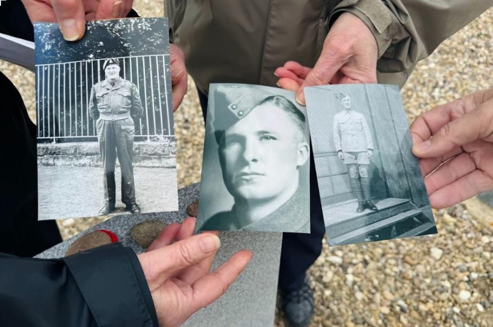 Relatives of Denis Denniel hold photos of him when he served in the Second World War.