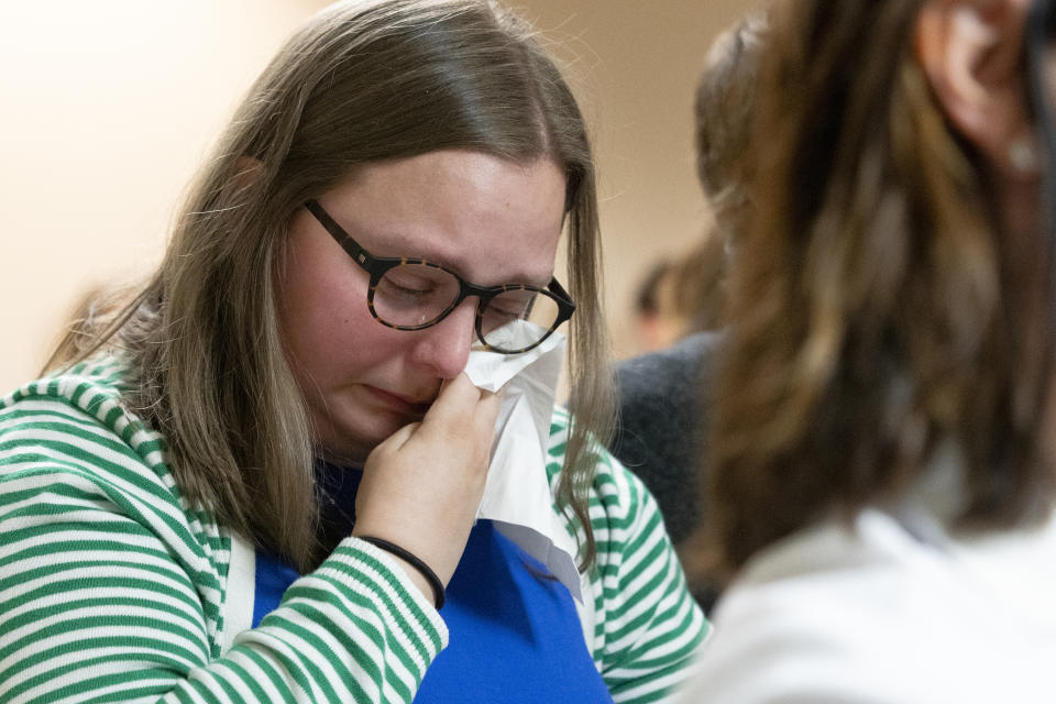 Rachel Fulton, a plaintiff in the Nicole Blackmon vs. the State of Tennessee, wipes away tears as she listens to arguments presented by her attorney in court, Thursday, April 4, 2024, in Nashville, Tenn. The case challenges the medical necessity exception to Tennessee's total abortion ban. (AP Photo/George Walker IV)