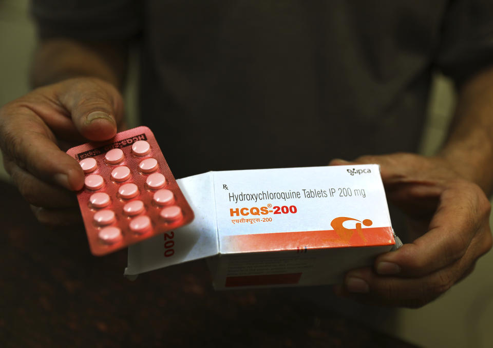 A chemist displays hydroxychloroquine tablets in New Delhi, India, Thursday, April 9, 2020. (AP Photo/Manish Swarup)