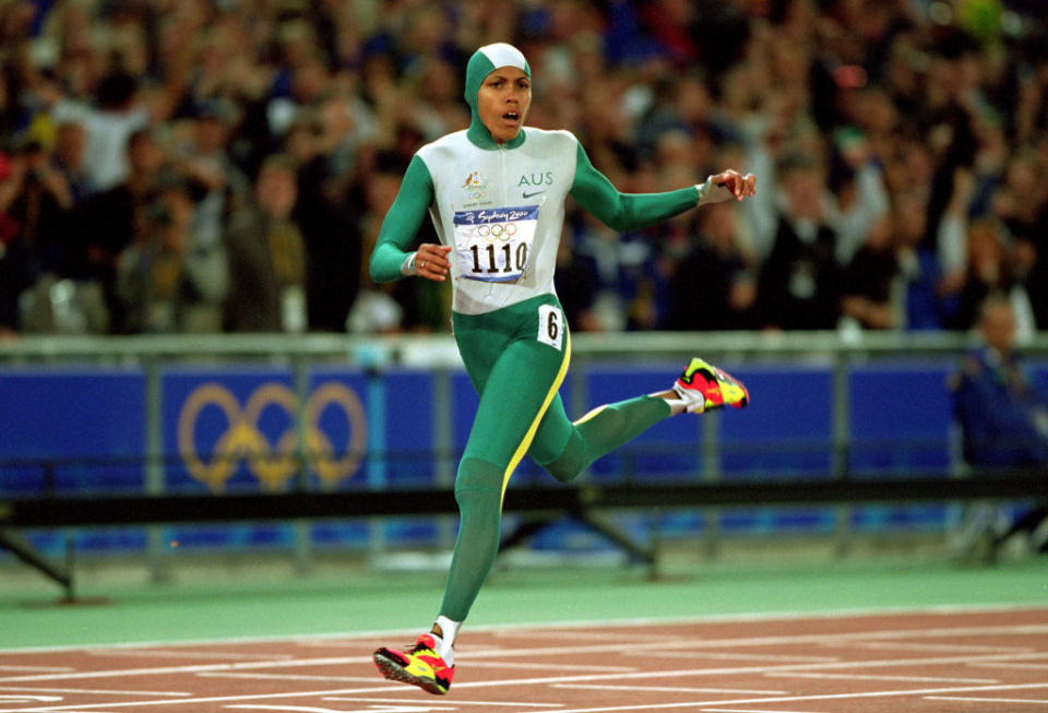 Cathy Freeman of Australia crosses the line to win gold in the Womens 400m Final at the Olympic Stadium on Day 10 of the Sydney 2000 Olympic Games in Sydney, Australia.