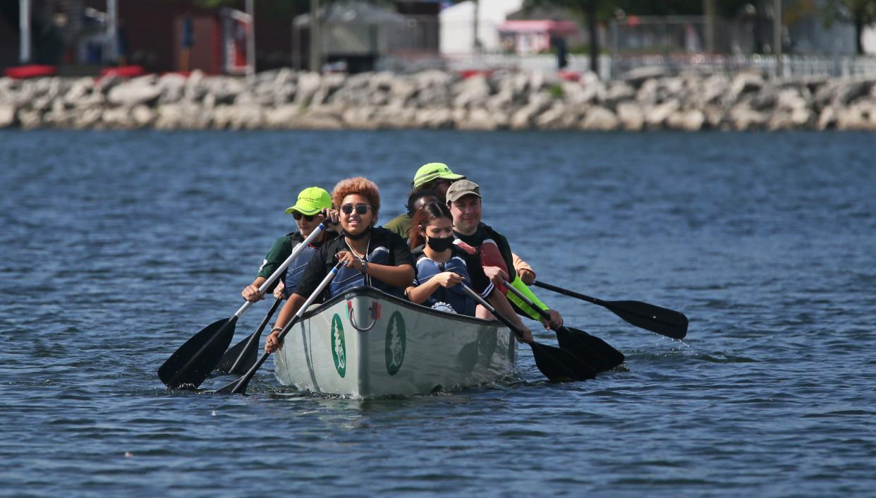 T  Anderson, 14, takes lead on Monday near Harbor Drive along with fellow student from Escuela Verde School Jadmary Flores, 15, right, for the Wilderness Inquiry's Canoemobile.