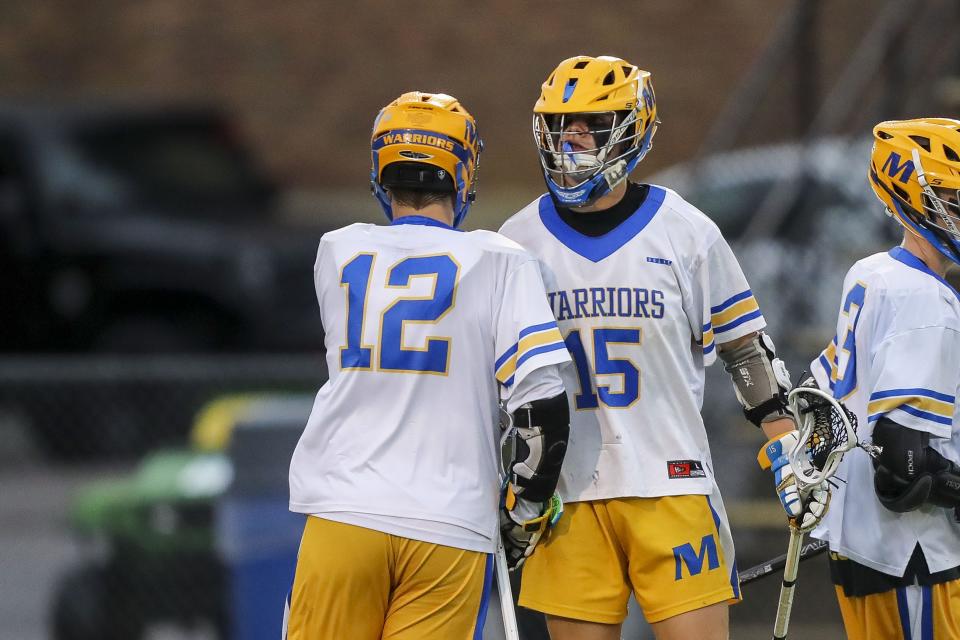 Mariemont attacker Max Tepe (15) reacts after scoring a goal with midfielder Sam Ciolino (12) in the first half against Cincinnati Hills Christian Academy at Mariemont High School May 26, 2022.