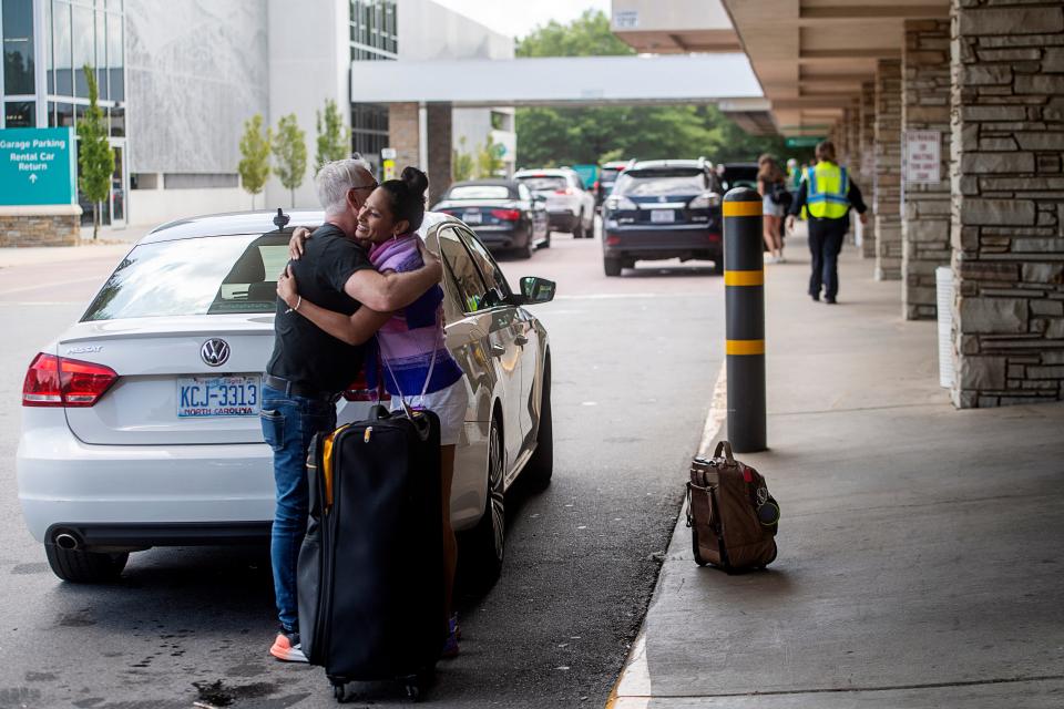 Travelers are dropped off at the Asheville Airport July 14, 2023.