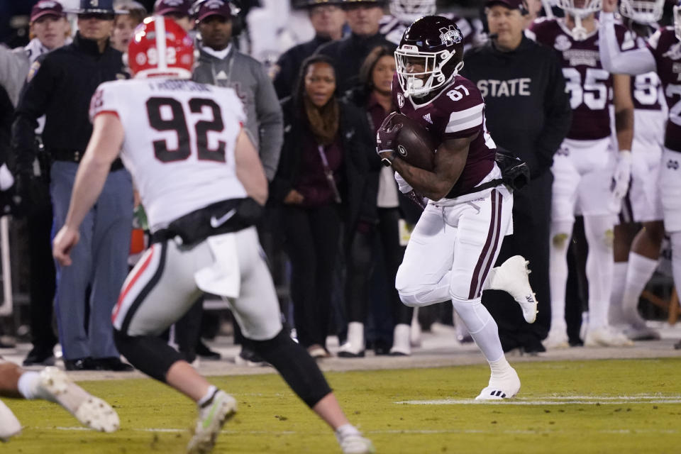 Georgia punter Brett Thorson (92) tries to stop Mississippi State wide receiver Zavion Thomas (87) from returning a punt 63-yards for a touchdown during the first half of an NCAA college football game in Starkville, Miss., Saturday, Nov. 12, 2022. (AP Photo/Rogelio V. Solis)