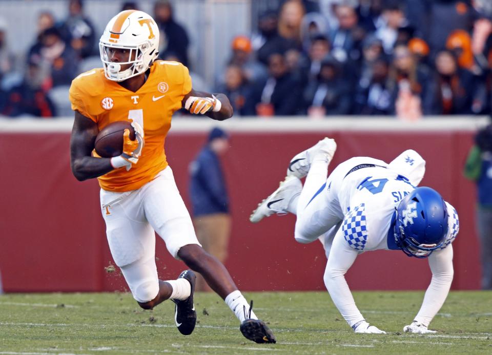 Tennessee wide receiver Marquez Callaway (1) escapes from Kentucky linebacker Jamin Davis (44) in the first half of an NCAA college football game Saturday, Nov. 10, 2018, in Knoxville, Tenn. (AP Photo/Wade Payne)