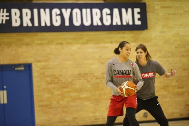 Coach Lisa Thomaidis works out during practice with player Nayo Raincock-Ekunwe in Toronto in 2018. The team's scheduled training camp for May 19 in Edmonton is uncertain as Alberta Health reviews Canada Basketball's proposal to safely hold the event. (Vince Talotta/Toronto Star via Getty Images - image credit)