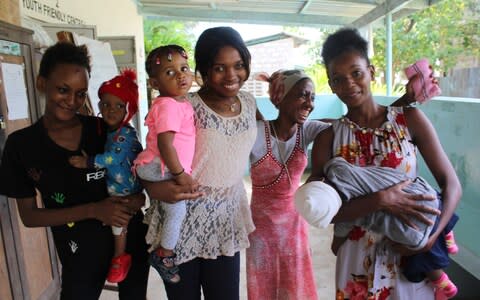 Sheila, 17, and her daughter Biana. Hope and her mother, Joanne, 24. Fatuma, 17, and Jasmine, 18, with her son Lucien.  - Credit: Sarah Newey