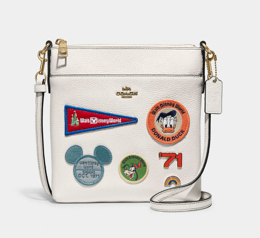 Disney X Coach Kitt Messenger Crossbody With Patches. Image via Coach.