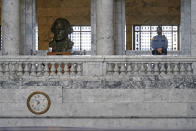 A Washington State Patrol trooper stands near a bust of President George Washington in the Legislative Building, Wednesday, Jan. 13, 2021, at the Capitol in Olympia, Wash. The building is closed to the public, and officials said that security on the Capitol campus will remain tight at least through next week when Joe Biden is sworn in as the President of the United States. (AP Photo/Ted S. Warren)