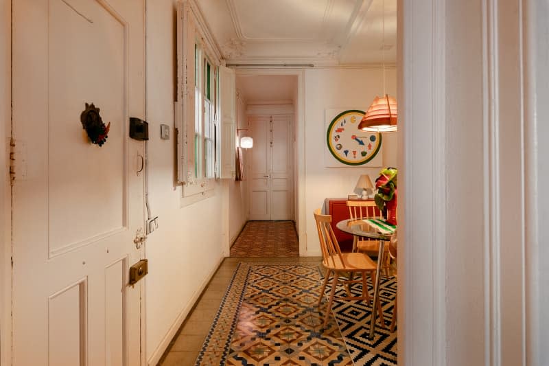 Multi-colored floor seen near front door.