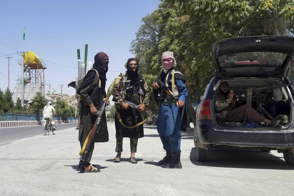 Taliban fighters pose for a photo as they patrol inside the city of Ghazni, southwest of Kabul, Afghanistan, Thursday, Aug. 12, 2021. The Taliban captured the provincial capital near Kabul on Thursday, the 10th the insurgents have taken over a weeklong blitz across Afghanistan as the U.S. and NATO prepare to withdraw entirely from the country after decades of war. (AP Photo/Gulabuddin Amiri)