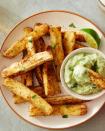 <p>Are you a <a href="https://www.delish.com/cooking/recipe-ideas/recipes/a45026/salt-n-pepper-sweet-potato-fries-recipe/" rel="nofollow noopener" target="_blank" data-ylk="slk:sweet potato;elm:context_link;itc:0;sec:content-canvas" class="link ">sweet potato</a> fry fan? You’re going to LOVE these. These sweet and nutty cassava fries admittedly do take a bit of preparation, but once you’ve peeled, chopped, and boiled them, you can turn them into extremely crispy fries that’ll rival any <a href="https://www.delish.com/cooking/recipe-ideas/a23361078/how-to-make-french-fries/" rel="nofollow noopener" target="_blank" data-ylk="slk:French fry;elm:context_link;itc:0;sec:content-canvas" class="link ">French fry</a>.</p><p>Get the <strong><a href="https://www.delish.com/cooking/recipe-ideas/a36702083/yuca-fries-recipe/" rel="nofollow noopener" target="_blank" data-ylk="slk:Baked Yuca Fries recipe;elm:context_link;itc:0;sec:content-canvas" class="link ">Baked Yuca Fries recipe</a></strong>.</p>