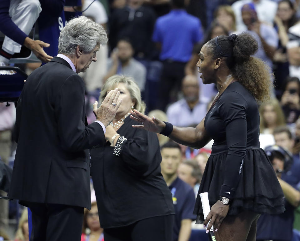 Serena Williams talks with referee Brian Earley during the women's final of the U.S. Open tennis tournament against Naomi Osaka, of Japan, Saturday, Sept. 8, 2018, in New York. (AP Photo/Julio Cortez)