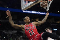 Chicago Bulls forward DeMar DeRozan (11) drives to the basket against San Antonio Spurs forward Drew Eubanks during the second half of an NBA basketball game, Friday, Jan. 28, 2022, in San Antonio. (AP Photo/Eric Gay)