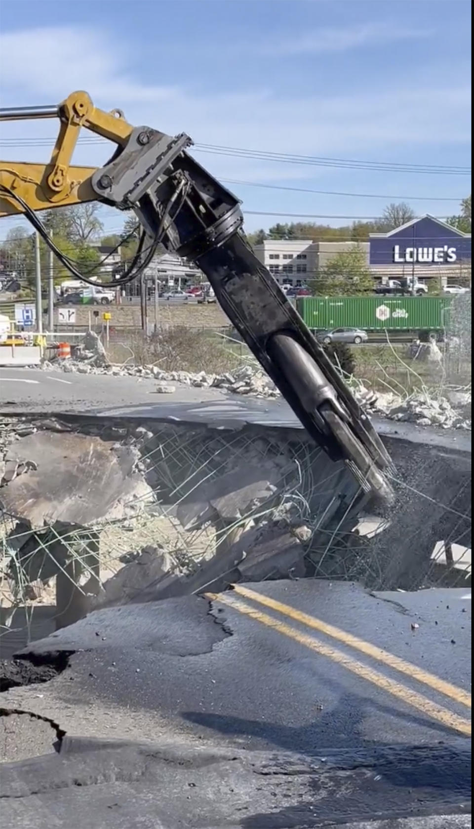 This photo provided by Norwalk, Conn. Police Dept., construction crews continue demolishing the Fairfield Avenue overpass early Saturday, May 4, 2024 in Norwalk, Conn. The bridge damaged in a fiery crash that kept Interstate 95 in Connecticut closed Thursday and Friday has been demolished. (Norwalk, Conn. Police Dept via AP)