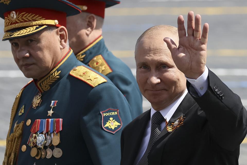 FILE - Russian President Vladimir Putin, right, and, Defense Minister Sergei Shoigu leave Red Square after the Victory Day military parade marking the 75th anniversary of the Nazi defeat in Moscow, Russia on June 24, 2020. Some in the West think Russian President Vladimir Putin may use the Victory Day on May 9 when Russia celebrates the defeat of Nazi Germany in World War II to officially declare that war is underway in Ukraine and announce a mobilization _ the claim rejected by the Kremlin. (Yekaterina Shtukina/Sputnik Kremlin Pool Photo via AP, File)