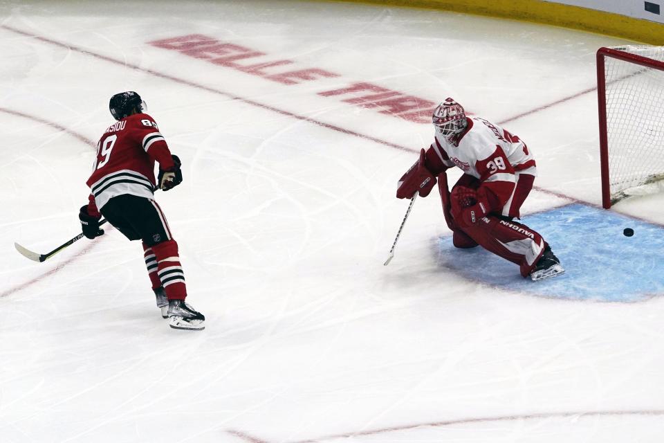 Chicago Blackhawks center Andreas Athanasiou (89) scores a penalty shot against Detroit Red Wings goaltender Alex Nedeljkovic (39) during the second period  at United Center in Chicago on Friday, Oct. 21, 2022.