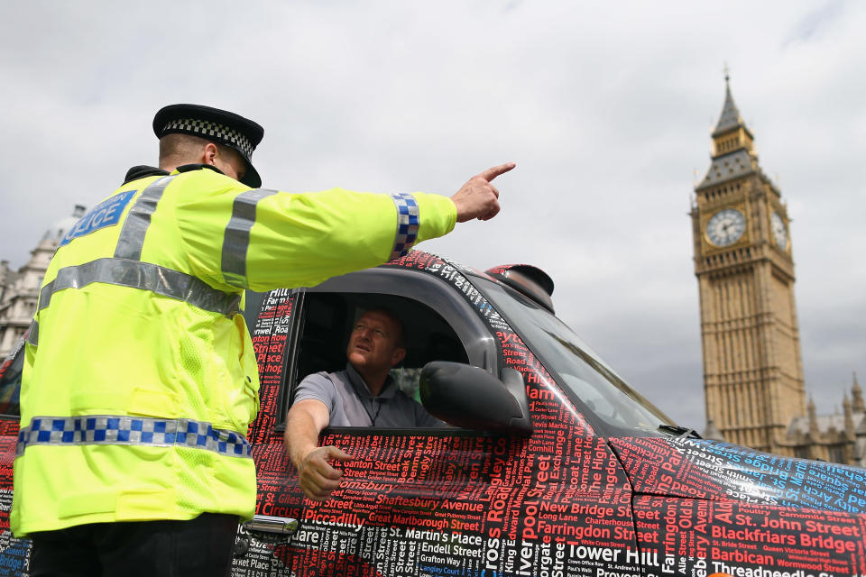 Taxi drivers demonstrate outside the Houses of Parliament on July 17, 2012 in London, England. The protest was targeted at London 2012 organisers over the ban on taxis being able to use the dedicated Olympic traffic lanes. (Photo by Dan Kitwood/Getty Images)