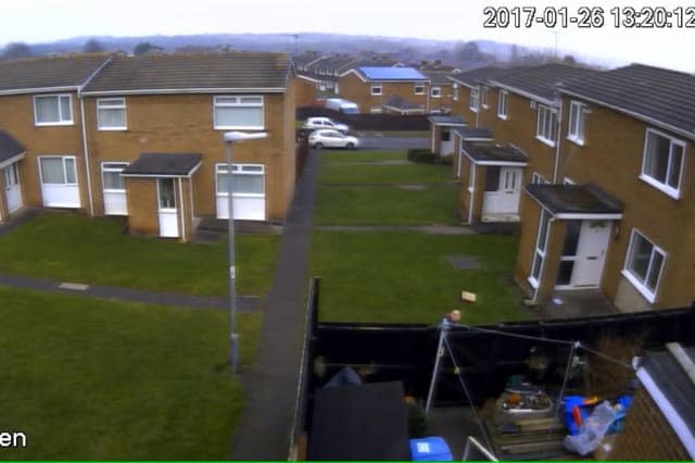 CCTV from the garden showing the Hermes delivery driver throw the parcel over the garden fencce in Chester-le-Street, County Durham. See Masons copy MNHERMES: A Hermes courier launched a customer's Â£50 delivery over a back garden fence without even checking if anyone was home first. The shocking moment was caught on CCTV as the man can be seen launching the small parcel the entire length of the 20ft garden. Customer Kaitlin Mitchinson, 19, had spent Â£41 on an eyeshadow palette which ending up landing at the back door. In the footage, captured last Thursday (26/01), the man can be seen jogging towards the back garden and heading towards the front of the house.