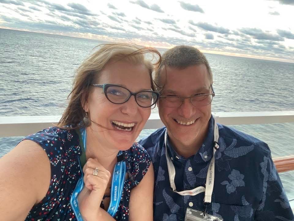 jill and her husband on a disney cruise deck