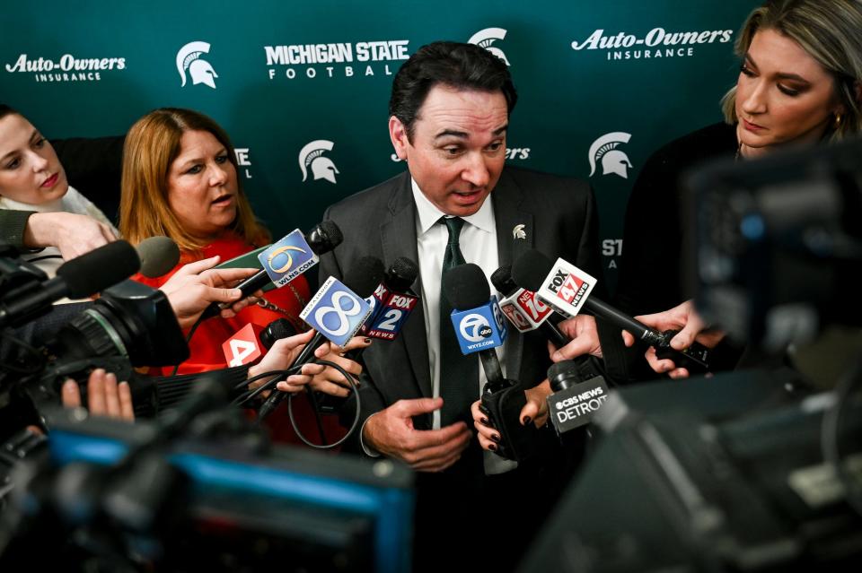 Michigan State football coach Jonathan Smith talks with reporters during an introductory press conference on Tuesday, Nov. 28, 2023, at the Breslin Center in East Lansing.