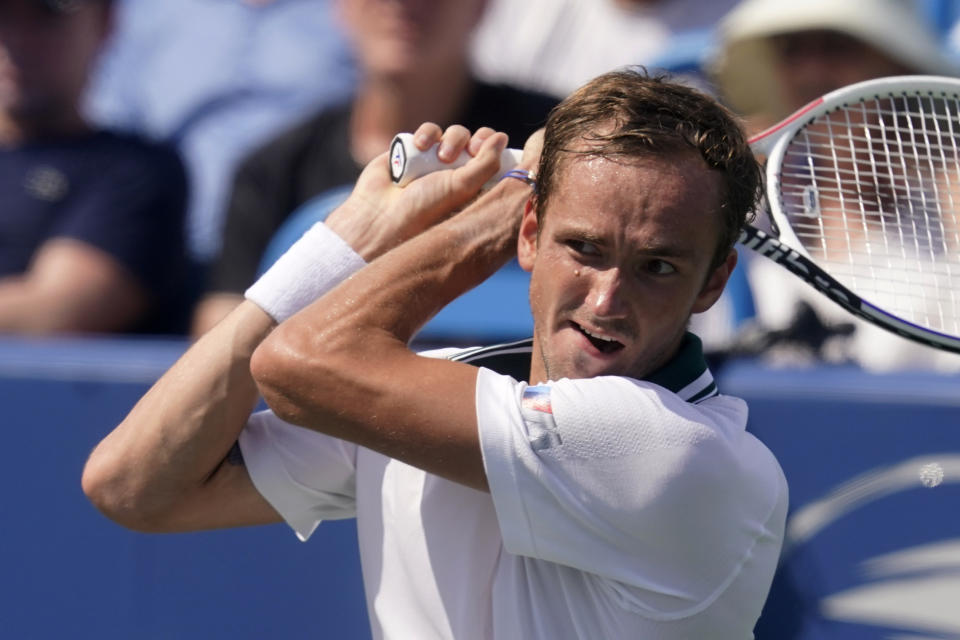 FILE - Daniil Medvedev, of Russia, returns a shot to Pablo Carreno Busta, of Spain, during the Western & Southern Open tennis tournament in Mason, Ohio, in this Friday, Aug. 20, 2021, file photo. Medvedev is seeded for the U.S. Open, the year's last Grand Slam tennis tournament. Play in the main draw begins in New York on Monday, Aug. 30. (AP Photo/Darron Cummings, File)