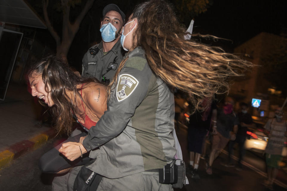 Israeli police arrest a protester near Israeli Prime Minister Benjamin Netanyahu's residence in Jerusalem, Saturday, Sept. 5, 2020. (AP Photo/Ariel Schalit)