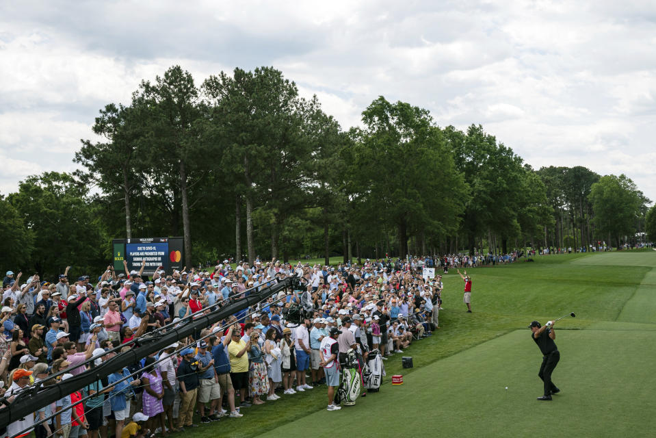 Phil Mickelson tees off on the first hole during the third round of the Wells Fargo Championship golf tournament at Quail Hollow on Saturday, May 8, 2021, in Charlotte, N.C. (AP Photo/Jacob Kupferman)