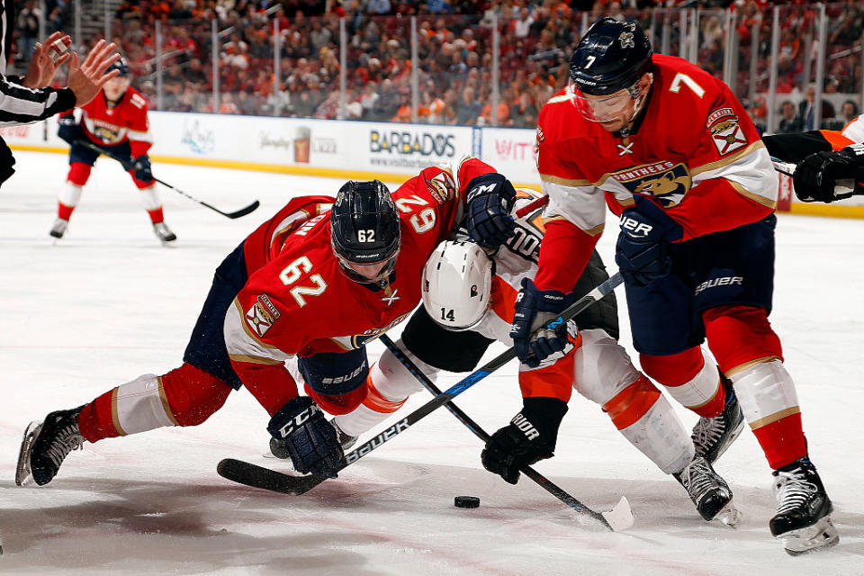 SUNRISE, FL - NOVEMBER 22: Denis Malgin #62 and teammate Colton Sceviour #7 of the Florida Panthers face off against Sean Couturier #14 of the Philadelphia Flyers at the BB&T Center on November 22, 2016 in Sunrise, Florida. (Photo by Eliot J. Schechter/NHLI via Getty Images)