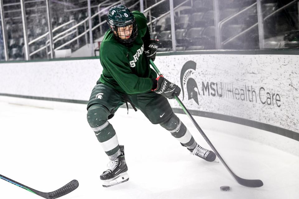 Michigan State's Artyom Levshunov moves the puck in practice during hockey media day on Wednesday, Sept. 27, 2023, at Munn Arena in East Lansing.