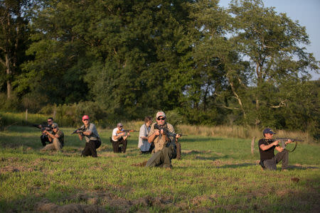 Jonathan Stern (C) and a group of other trainees, demonstrate a takeover exercise against a hostile element as part in the Cherev Gidon Firearms Training Academy in Honesdale, Pennsylvania, U.S. August 5, 2018 Picture taken August 5, 2018. REUTERS/Noam Moskowitz