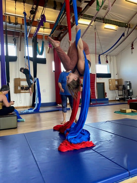 <span class="article__caption">Silks helped me improve my balance and core strength (as shown here), as well as flexibility and body awareness in general.</span> (Photo: Corey Buhay)