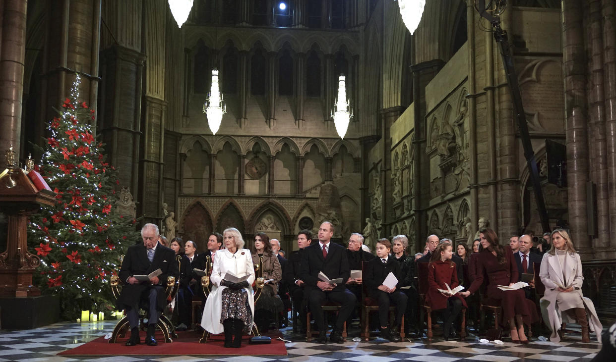 FILE - Front row from left, Britain's King Charles III, Camilla the Queen Consort, Prince William, Prince George, Princess Charlotte, Kate Princess of Wales and the Sophie, Countess of Wessex, sit, during the 'Together at Christmas' Carol Service at Westminster Abbey in London, Thursday, Dec. 15, 2022. King Charles III will hope to keep a lid on those tensions when his royally blended family joins as many as 2,800 guests for the new king’s coronation on May 6 at Westminster Abbey. All except Meghan, the Duchess of Sussex, who won’t be attending. (Yui Mok/Pool Photo via AP, File)