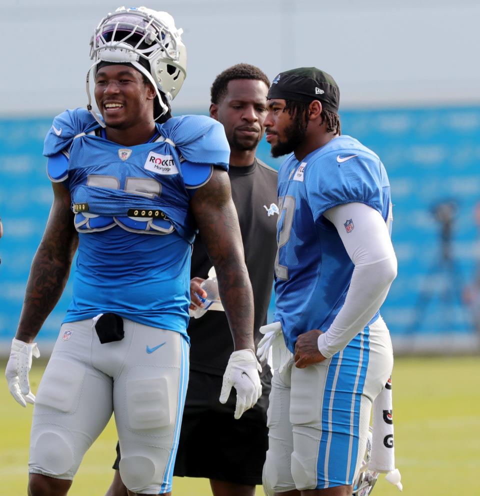 Lions running backs Jamaal Williams, left, and D'Andre Swift watch the action during training camp on Tuesday, August 3, 2021, in Allen Park.