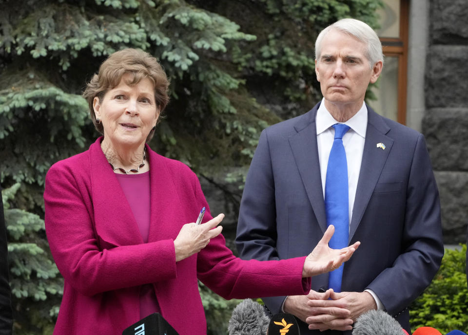 U.S. Senator Jeanne Shaheen, D-N.H., left, speaks as U.S. Senator Rob Portman, R-Ohio, looks on during a briefing at Ukrainian Presidential office after their meeting with Ukrainian President Volodymyr Zelenskiy in Kyiv, Ukraine, Wednesday, June 2, 2021. (AP Photo/Efrem Lukatsky)