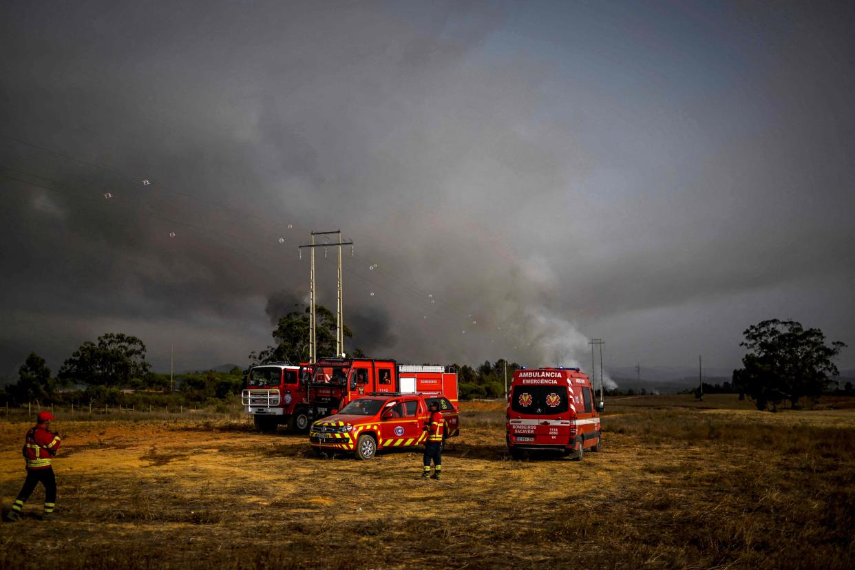 Firefighter watch the progression of a wildfire in Odeceixe, south of Portugal, 8 August (AFP via Getty Images)