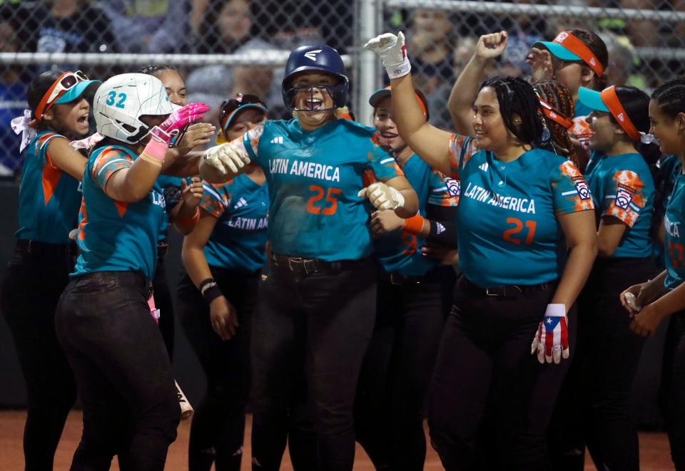 Latin America's Ylime Torres (25) celebrates her home run that gave her team a 3-1 lead in the third inning of Delaware District 3's (Lower Sussex) 6-5 loss to Latin America (Guanica, Puerto Rico) in pool play during the Senior Softball World Series in Roxana, Wednesday, August 2, 2023.