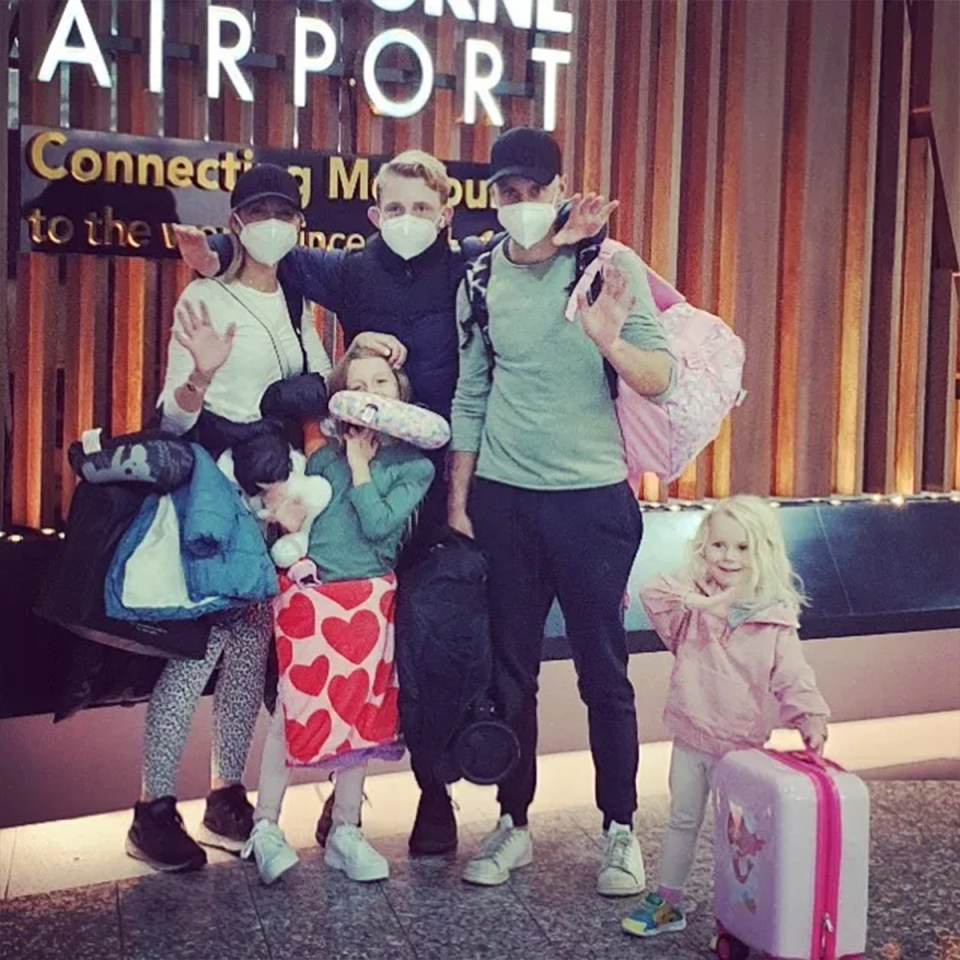 Carrie Bickmore with her family at Melbourne airport.