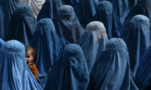 Shah Marai had for more than 15 years been documenting Afghanistan - including this 2014 photo of women at an election rally